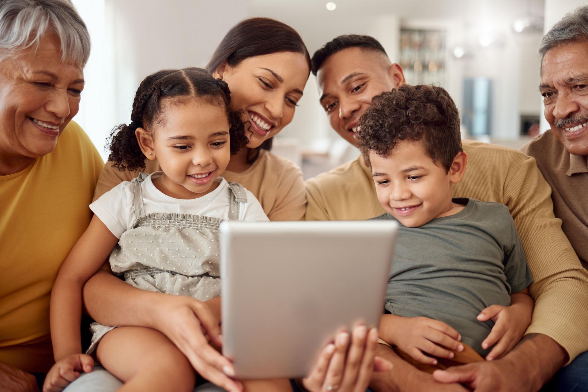 Family, tablet and video call with smile sofa together in living room in home with love, happiness and bonding. Black family, video conference and technology for communication, kids and parents